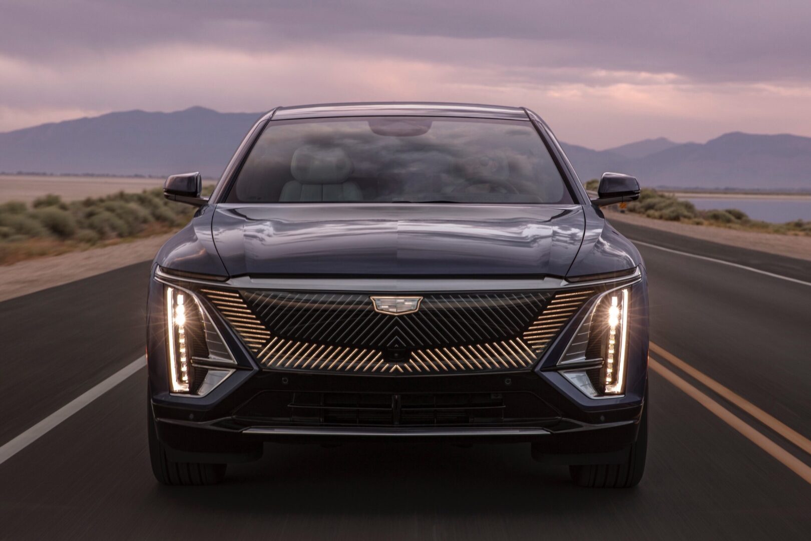 The 2020 cadillac xt5 is driving down the road.