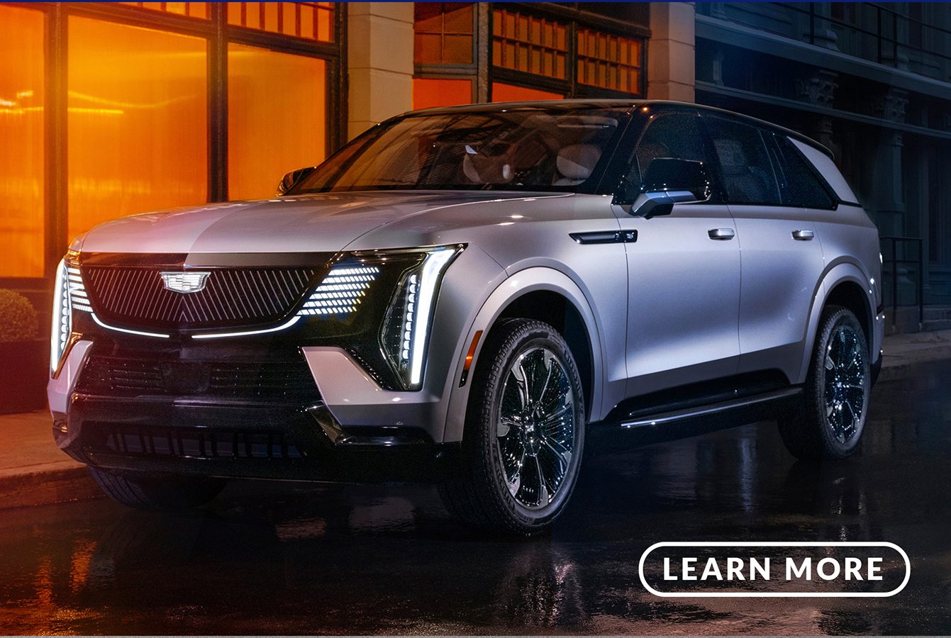 The 2020 cadillac xt5 suv is parked on a street at night.