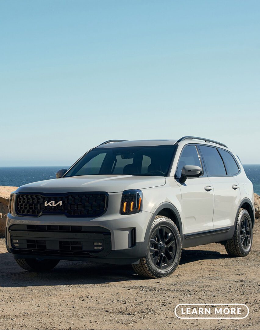 The 2020 kia telluride is parked on the beach.