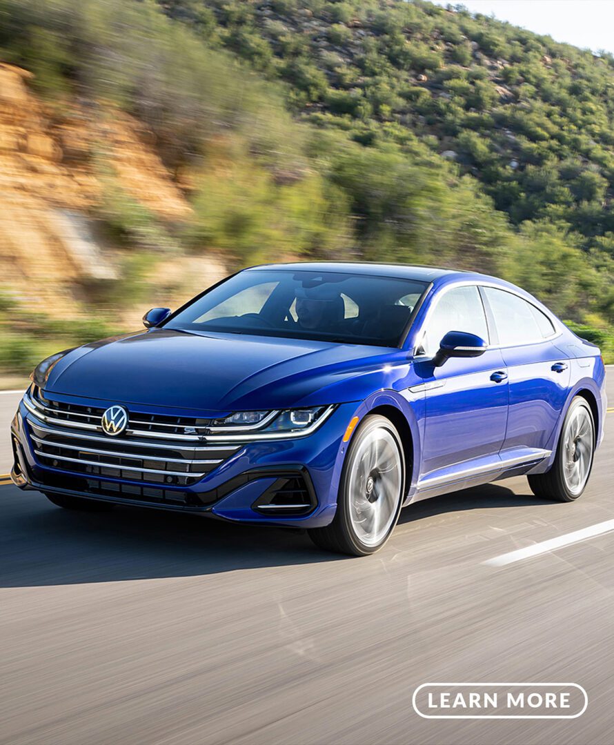 The 2019 volkswagen arteon driving down a mountain road.