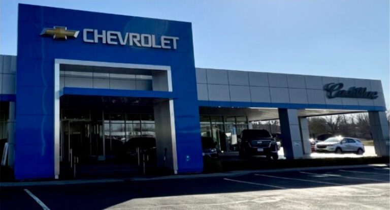 A chevrolet dealership with a blue sign.
