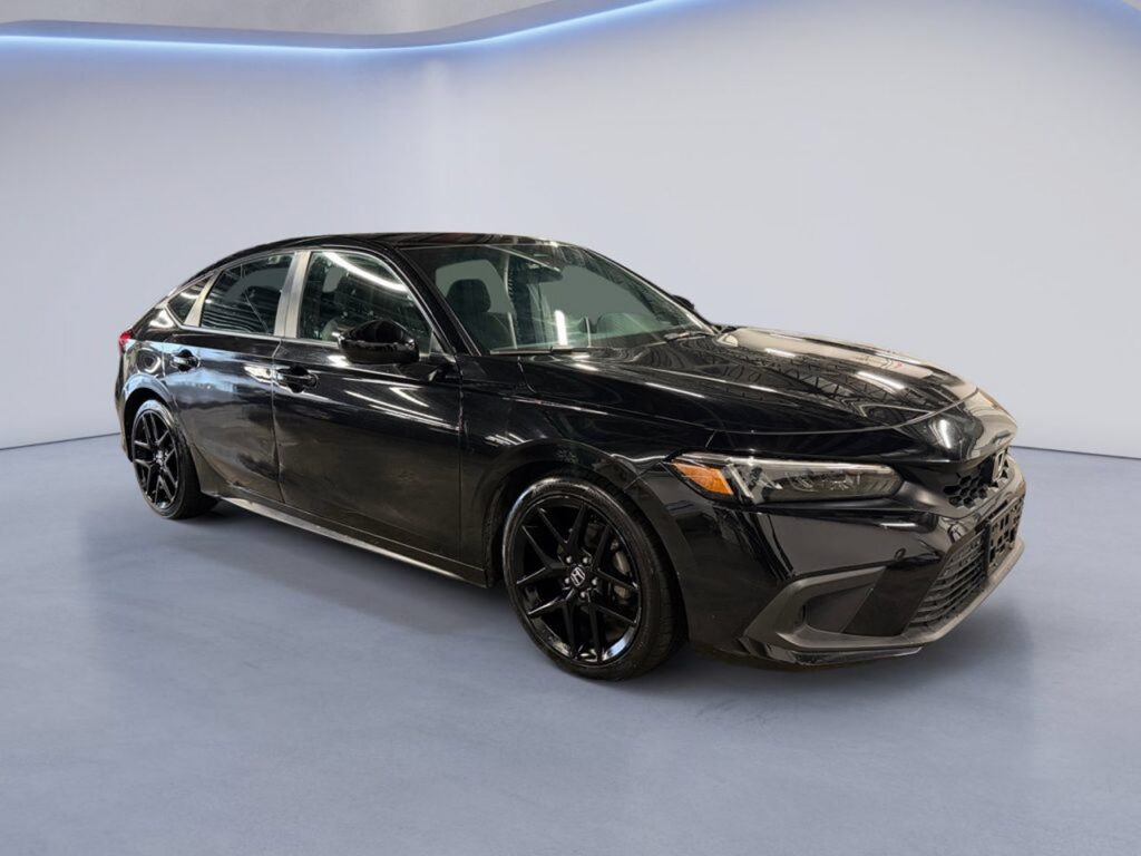 Black sedan in modern showroom