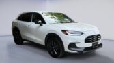 White compact SUV parked in studio