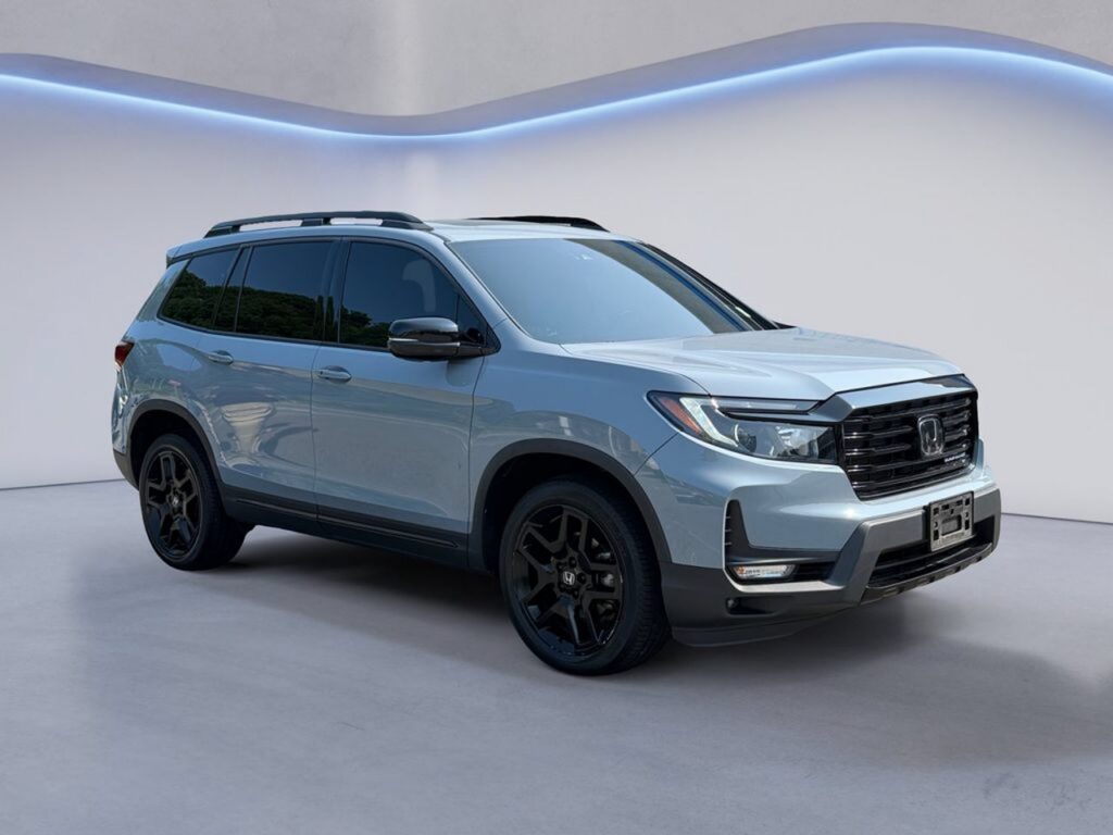 Light gray Honda SUV with black wheels