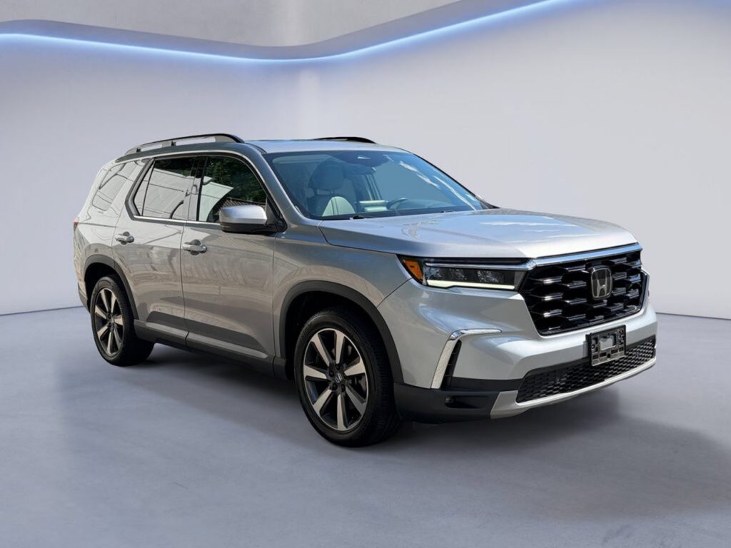 Silver Honda SUV parked in showroom