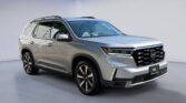 Silver Honda SUV parked in showroom