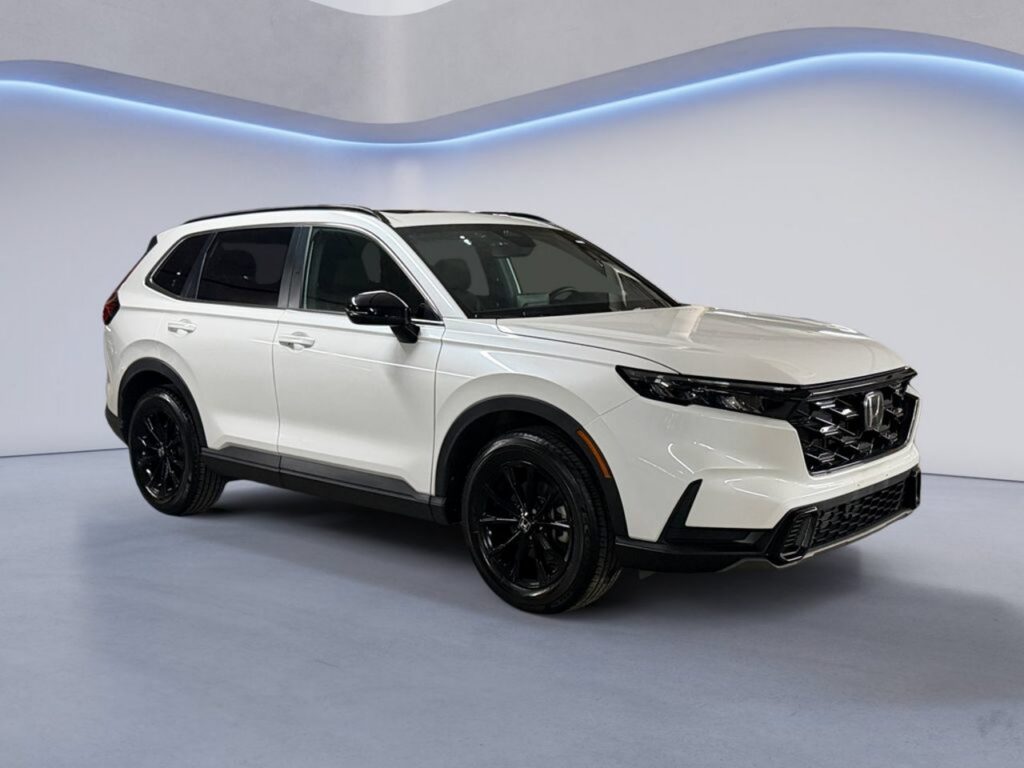 White Honda SUV with black wheels in studio