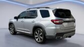 Silver SUV rear three-quarter view in studio