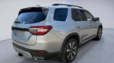 Silver mid-size SUV rear three-quarter view