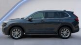 Dark gray SUV side profile on studio background