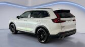 White Honda CR-V SUV in showroom