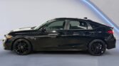 Sleek black hatchback car side profile