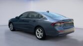 Gray sedan rear three-quarter view in studio
