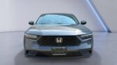 Gray Honda sedan front view in showroom
