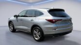 Silver crossover SUV in studio showroom