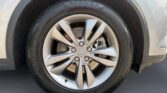Close-up of silver alloy wheel and tire