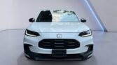 White Honda crossover front view in showroom