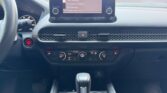 Car dashboard with infotainment screen and shifter