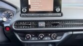 Car dashboard with infotainment screen and controls