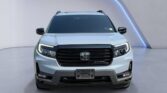 Silver Honda SUV front view in studio
