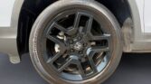 Black Honda alloy wheel and tire