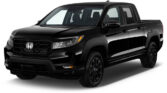 Black Honda pickup truck angled front view