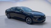 Sleek black sedan photographed in studio