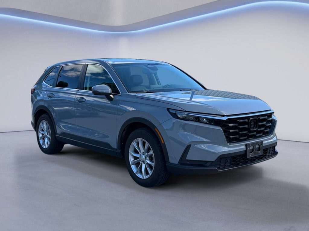 Gray SUV displayed in modern studio