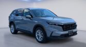 Gray SUV displayed in modern studio