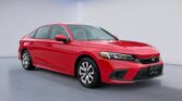 Red Honda Civic sedan in studio