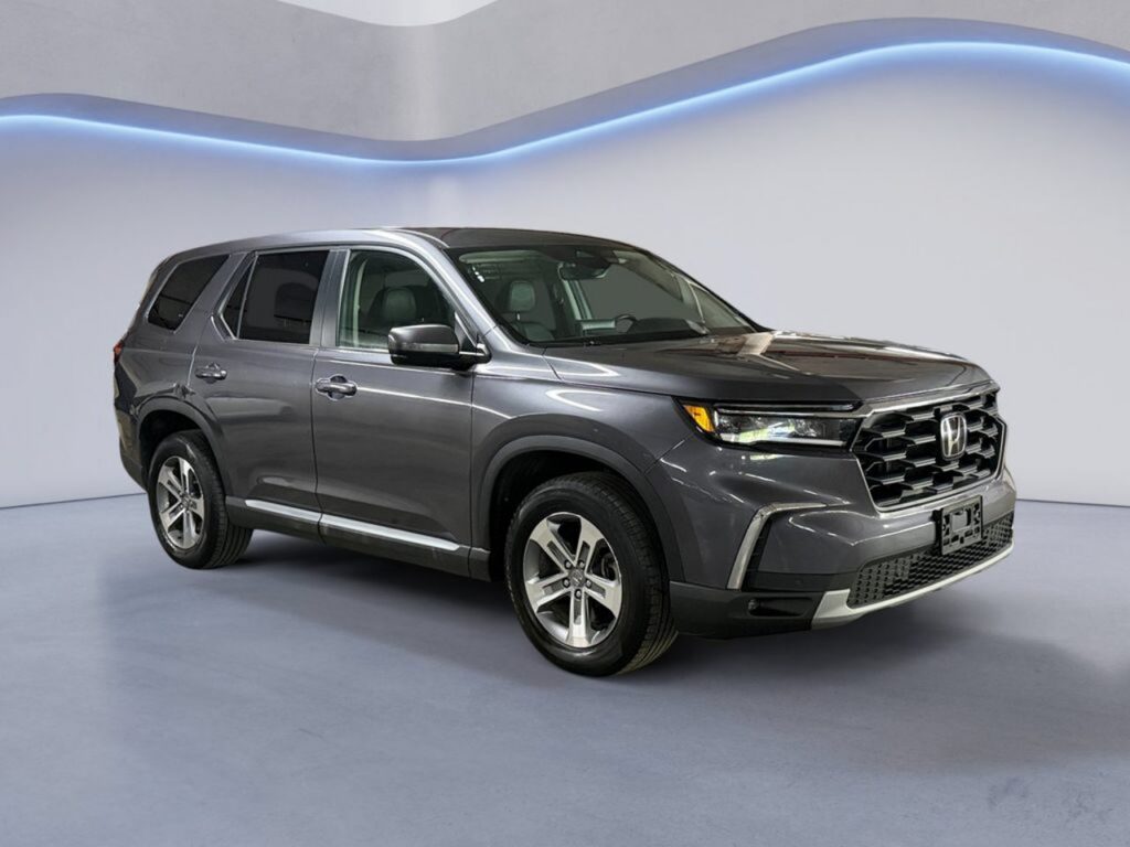Gray Honda SUV in studio showroom
