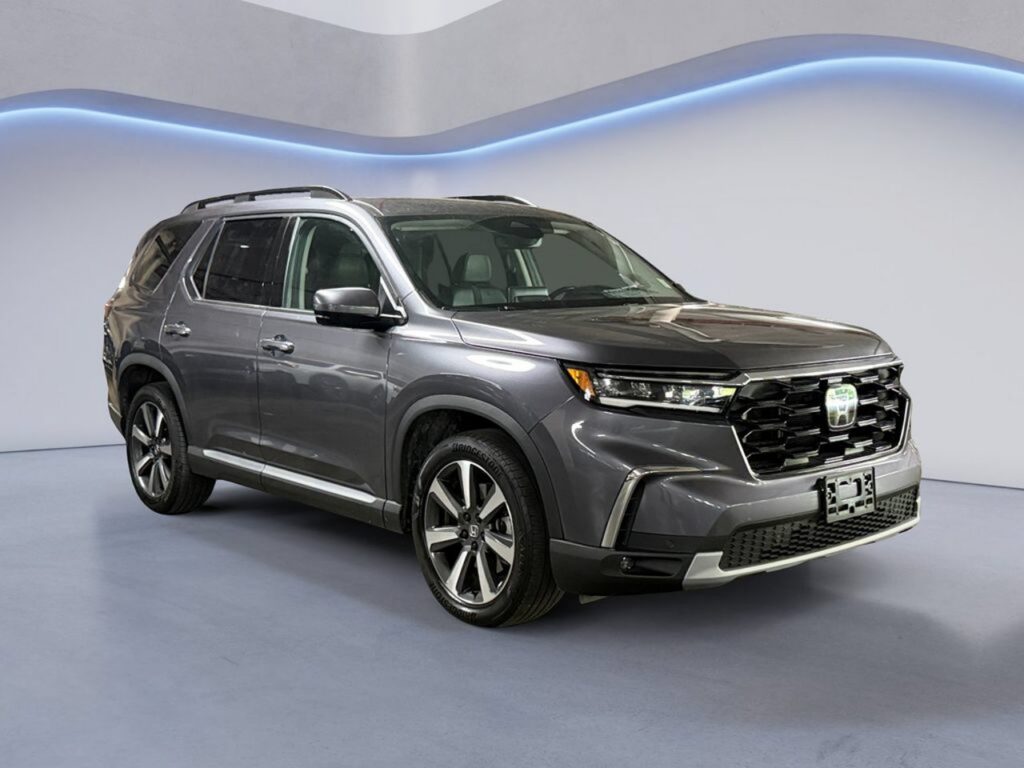 Gray Honda SUV in showroom