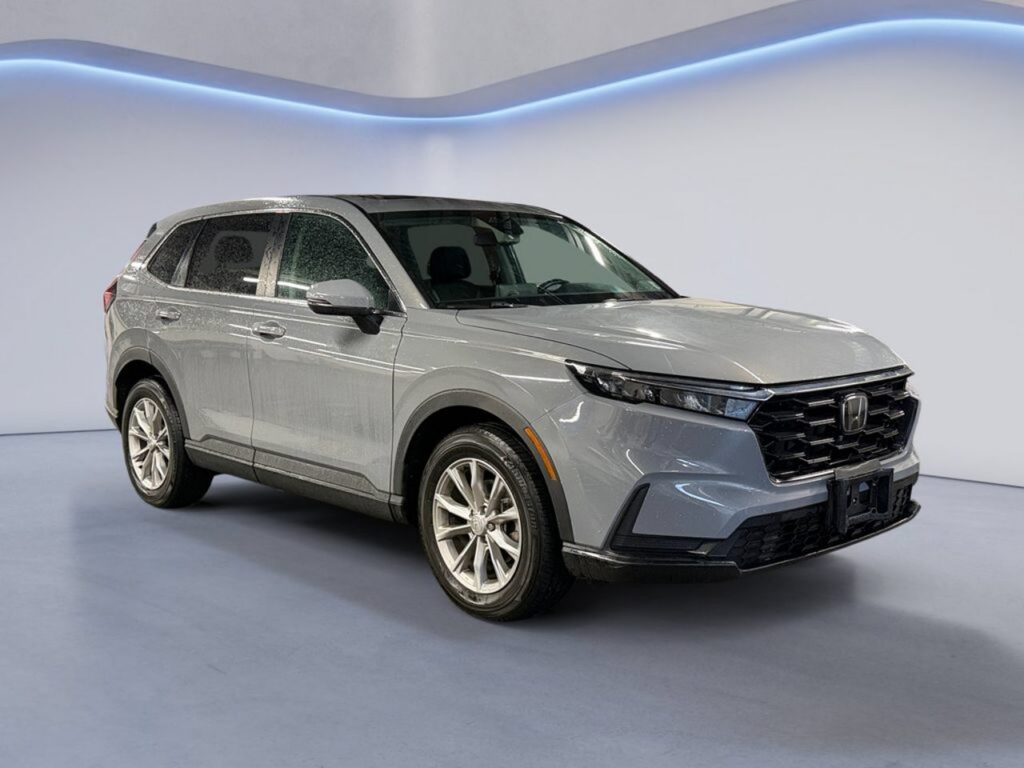 Silver Honda SUV in showroom setting