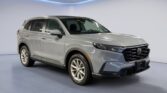 Silver Honda SUV in showroom setting