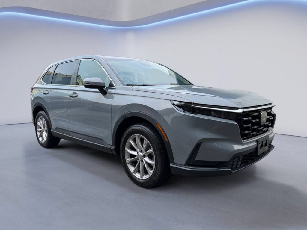Gray midsize SUV displayed in showroom