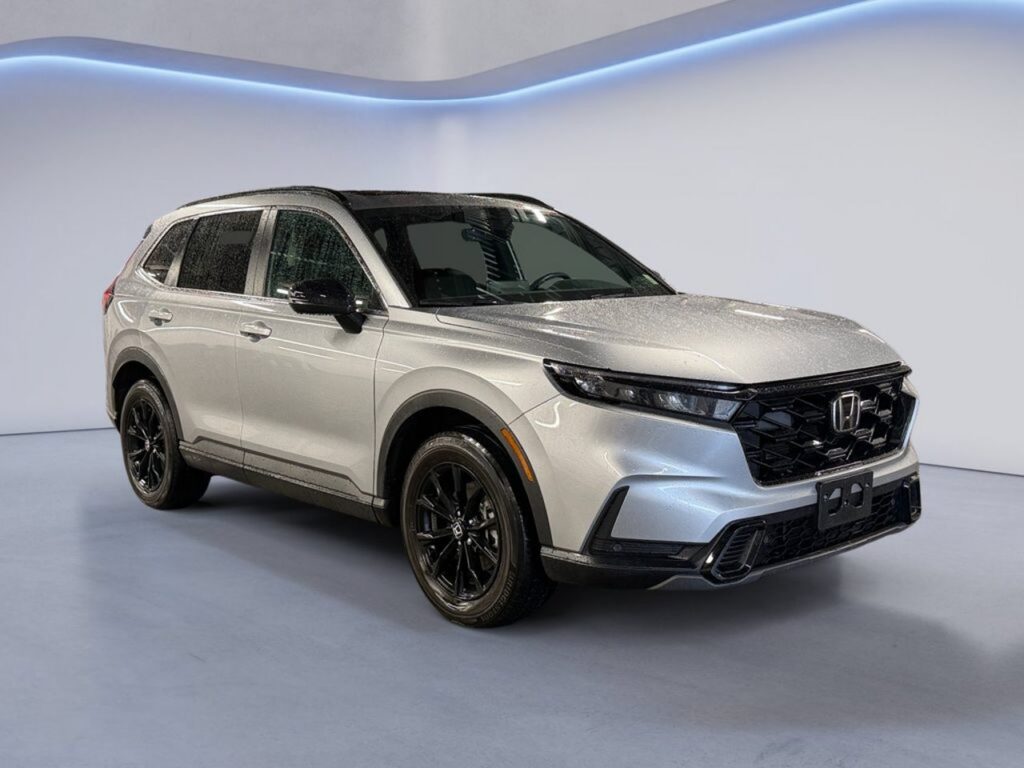 Silver Honda SUV parked in showroom studio