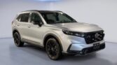 Silver Honda SUV parked in showroom studio