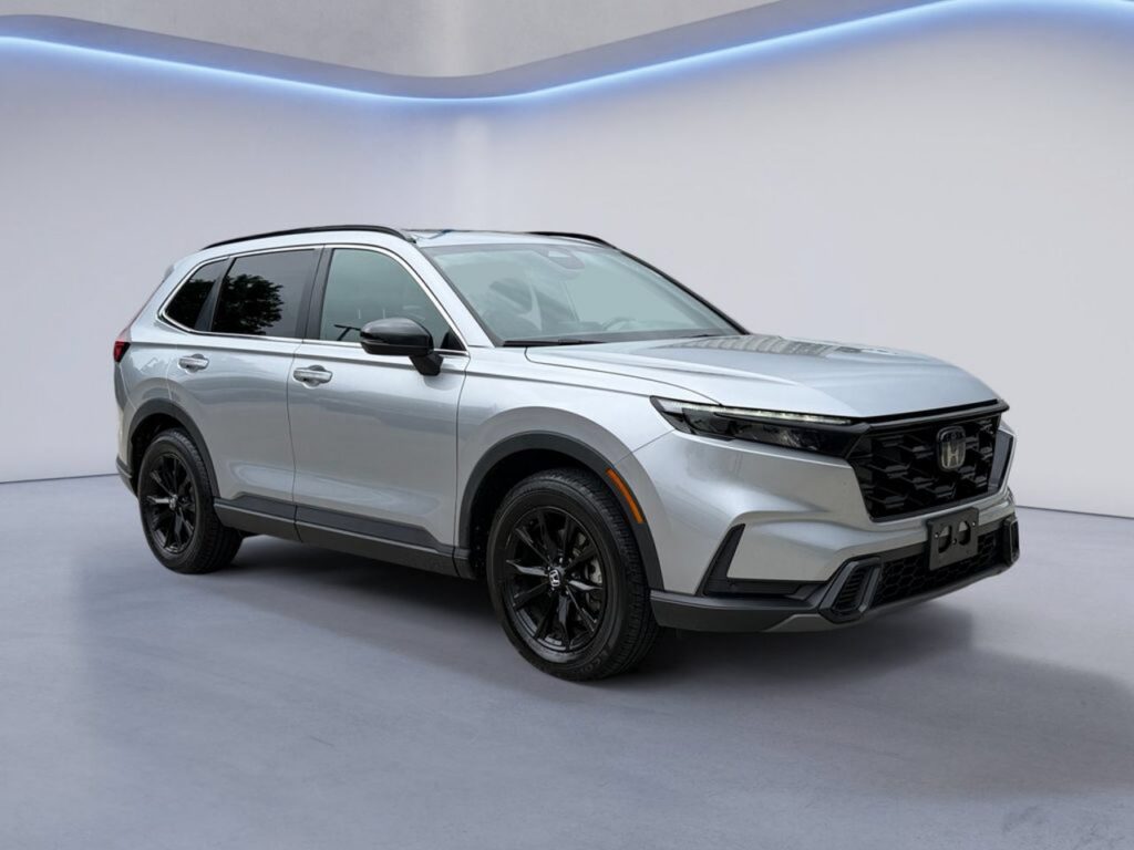 Silver Honda SUV in white showroom