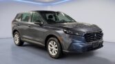 Gray Honda SUV in showroom with water droplets