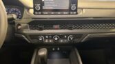 Modern car dashboard with touchscreen and gear shifter