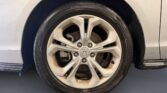 Silver Honda alloy wheel and tire close-up