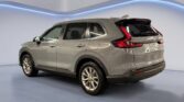 Silver SUV in showroom with blue accent lighting