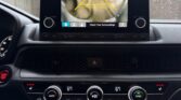 Car dashboard showing backup camera display