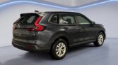 Dark gray SUV in modern studio showroom