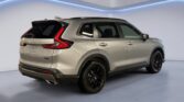 Silver SUV rear three-quarter studio view