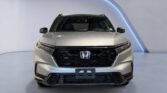 Silver Honda SUV front view in showroom
