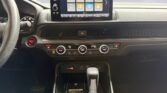 Car dashboard with touchscreen and gear shifter