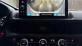 Car dashboard showing backup camera and controls