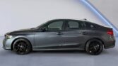 Gray sedan side profile with black wheels