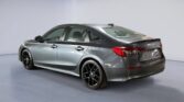 Metallic gray sedan in studio photoshoot